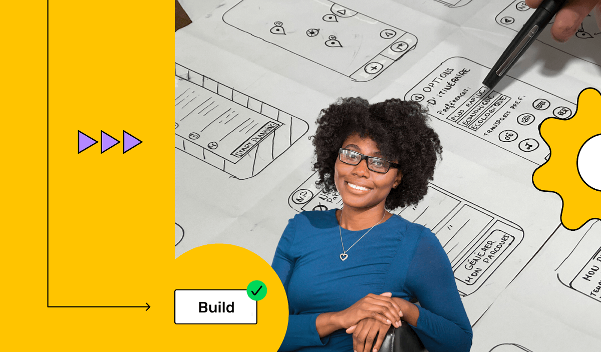 A lady designer having app wireframes in her background