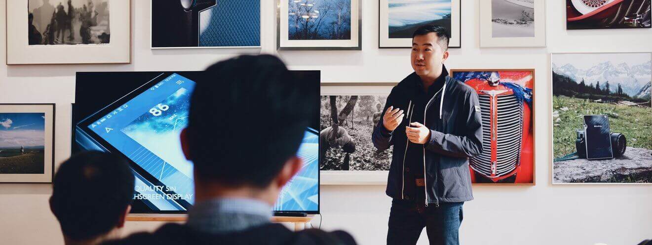 Man beside flat screen