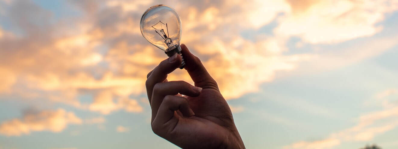 Person holding light bulb